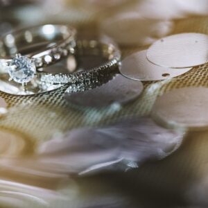 Home an engagement rings of bride and groom focused on the diamond head